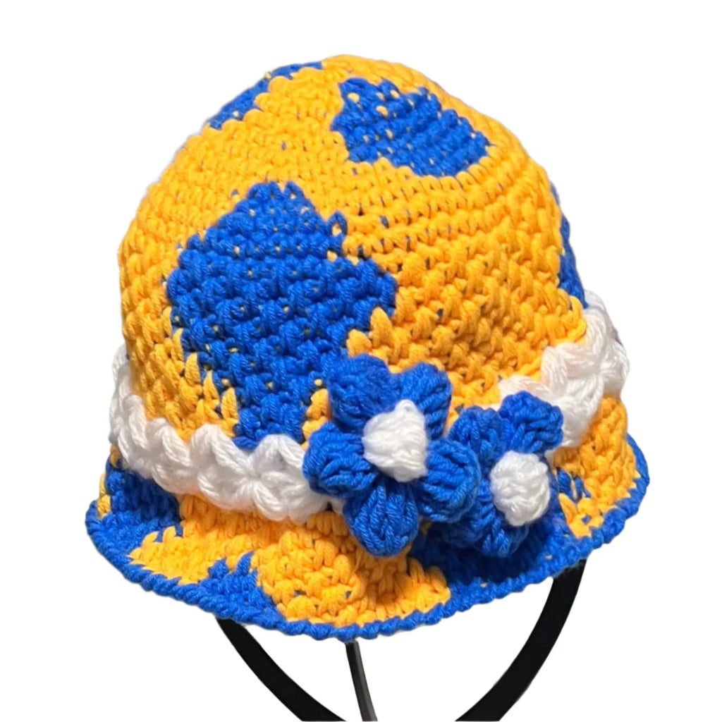 Colorful crochet bucket hat bucket in yellow and blue with a white flower detail