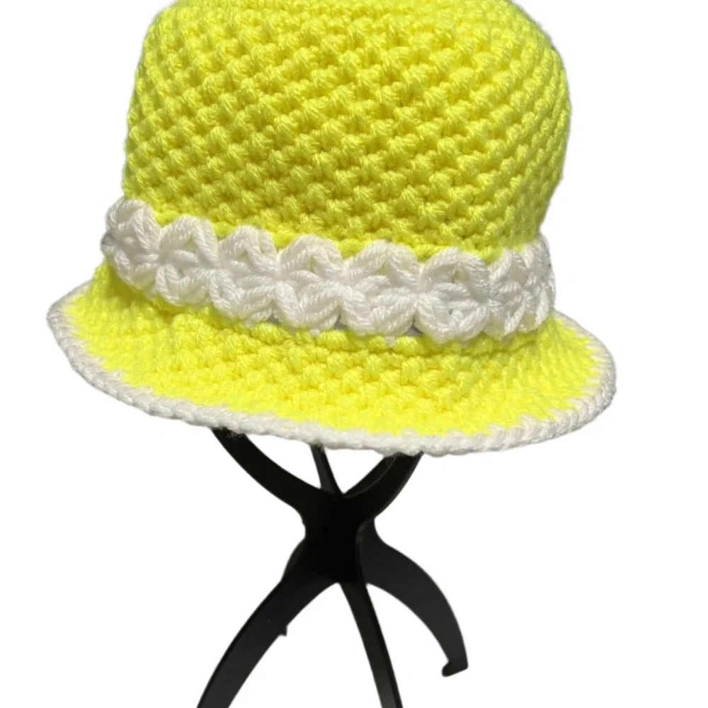 Bright yellow crochet bucket hat bucket with white decorative band, perfect for sunny days