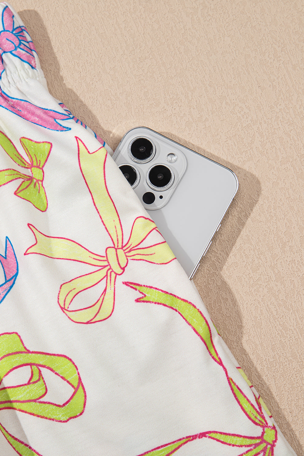 LuckeLAdybug LLC Casual shorts for mens with colorful ribbon patterns and a smartphone tucked in