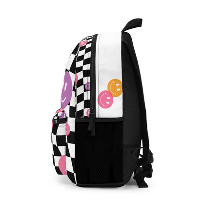 LuckeLadybug checkered smiley face backpack with black and white squares and colorful smiley faces