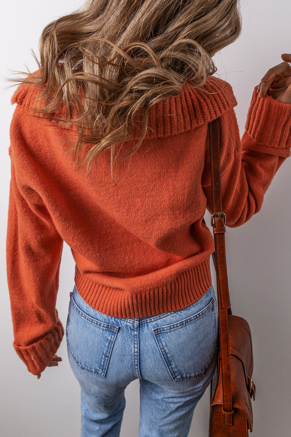 Back view of a chestnut v neck sweater for women with a relaxed fit and stylish detailing