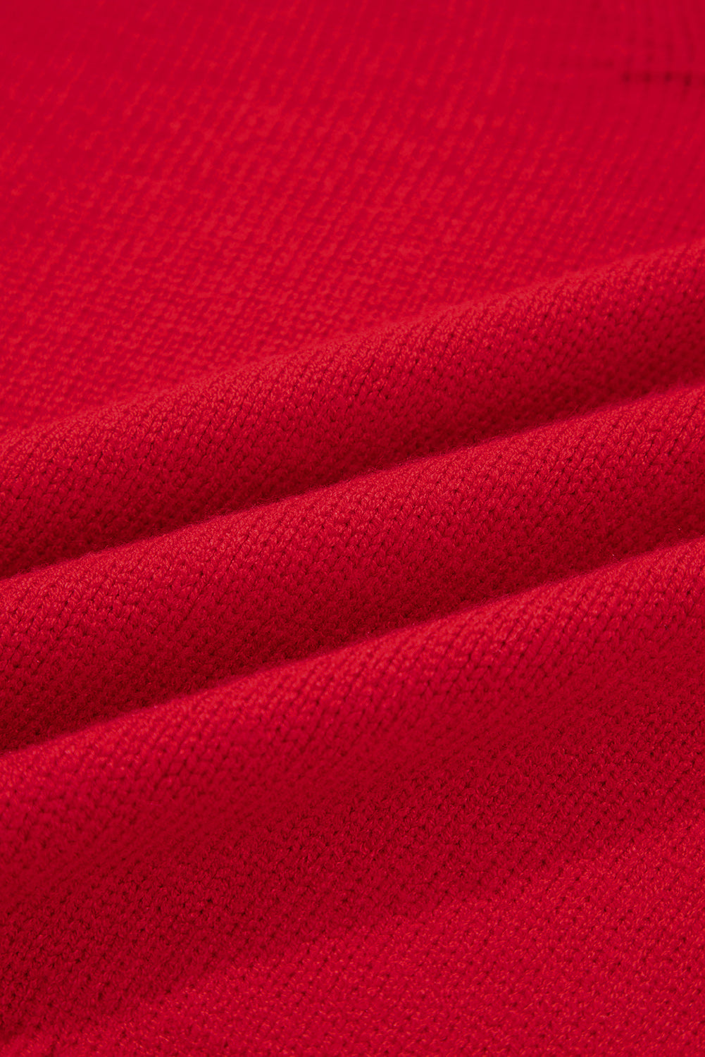 Close-up of fabric texture showing the soft weave of a chestnut v neck sweater for women