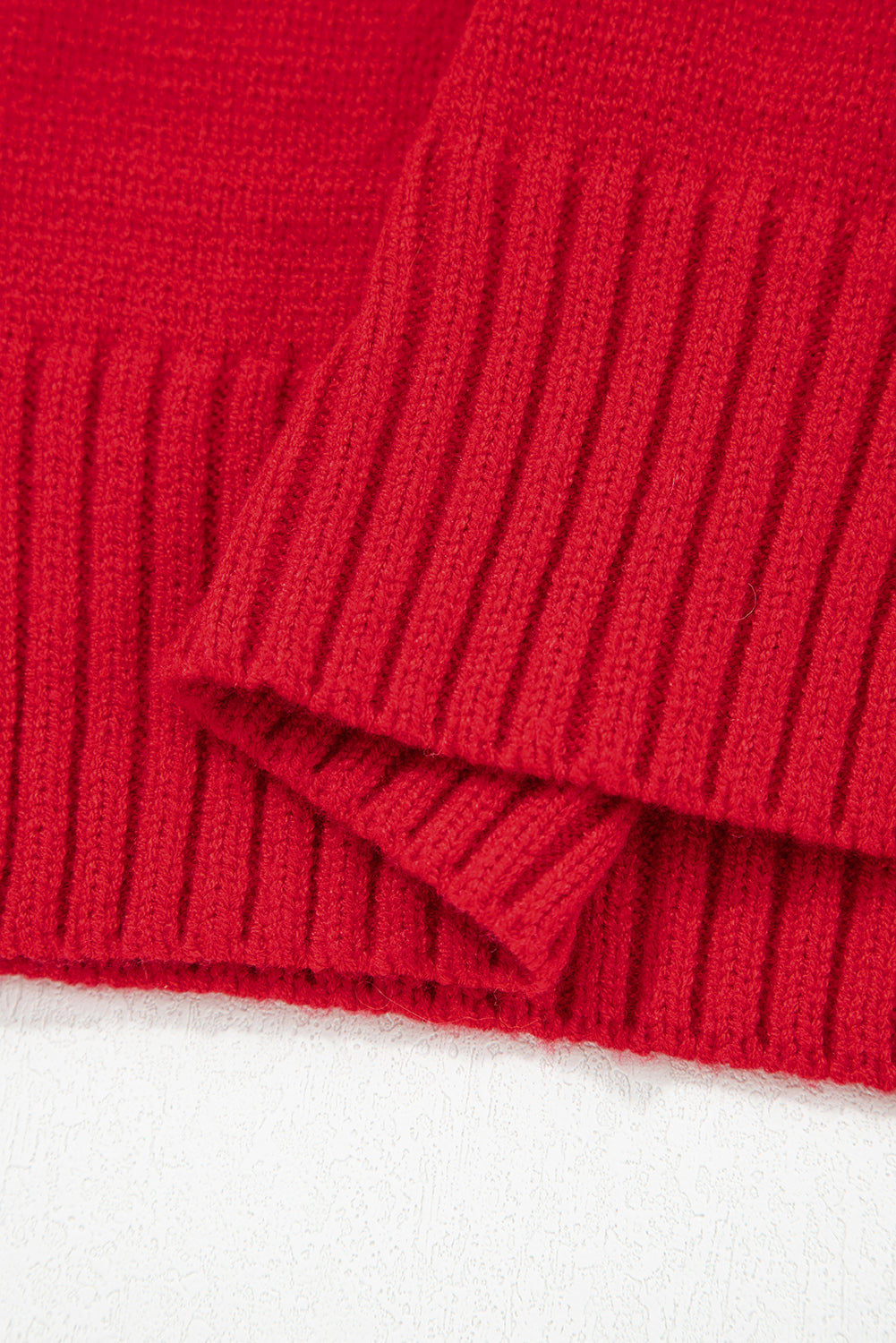 Close-up of the ribbed hem of a chestnut v neck sweater for women from LuckeLadybug LLC