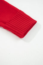 Close-up of a red sweater sleeve showcasing ribbed detailing for the chestnut v neck sweater for women