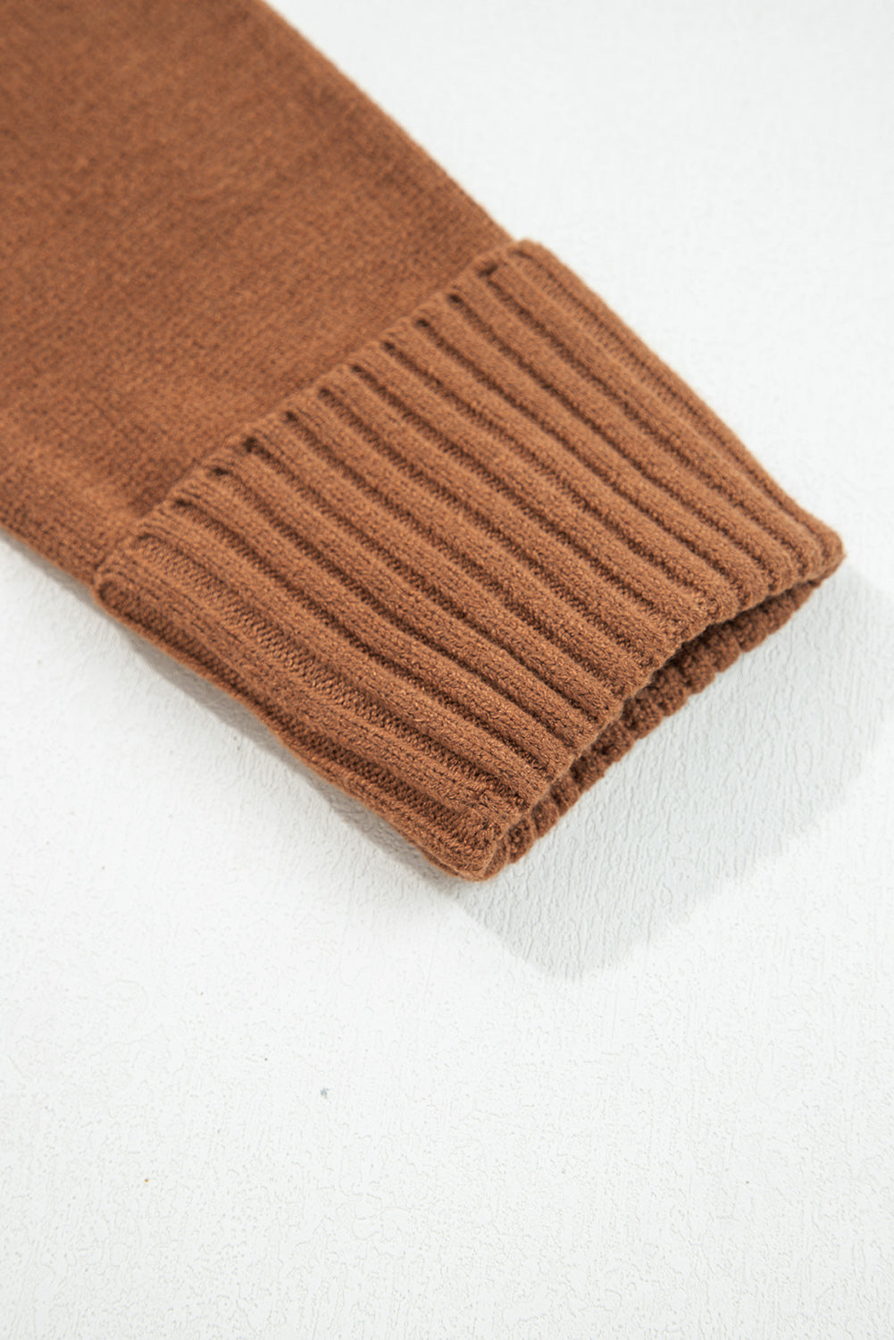 Close-up of the cuff detail on a chestnut v neck sweater for women by LuckeLadybug LLC
