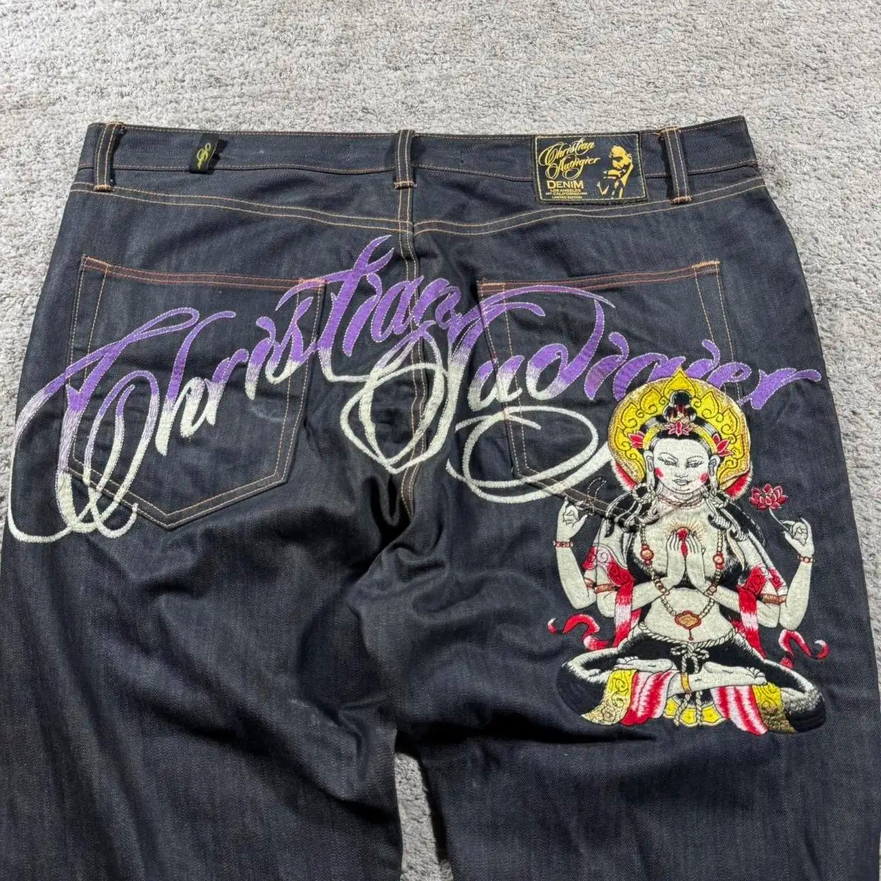 Stylish Y2K baggy jeans for women featuring unique embroidery and vibrant graphics