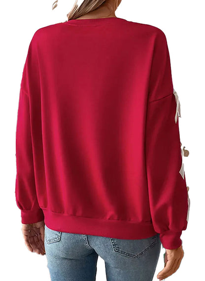 Christmas bow women’s sweatshirt in festive red with stylish back design for holiday wear