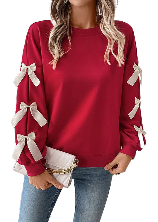 Red Christmas bow women’s sweatshirt featuring stylish white bows on the sleeves for festive fashion