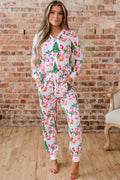 LuckeLadybug LLC Christmas pajamas in pink with festive prints of Santa and Christmas trees