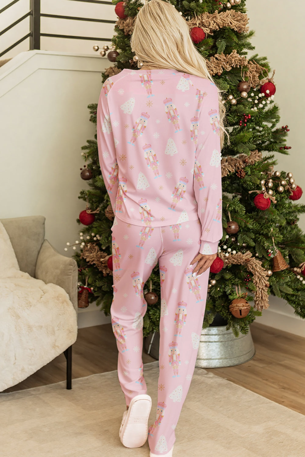 Cozy pink Christmas pajamas featuring festive prints, perfect for holiday relaxation