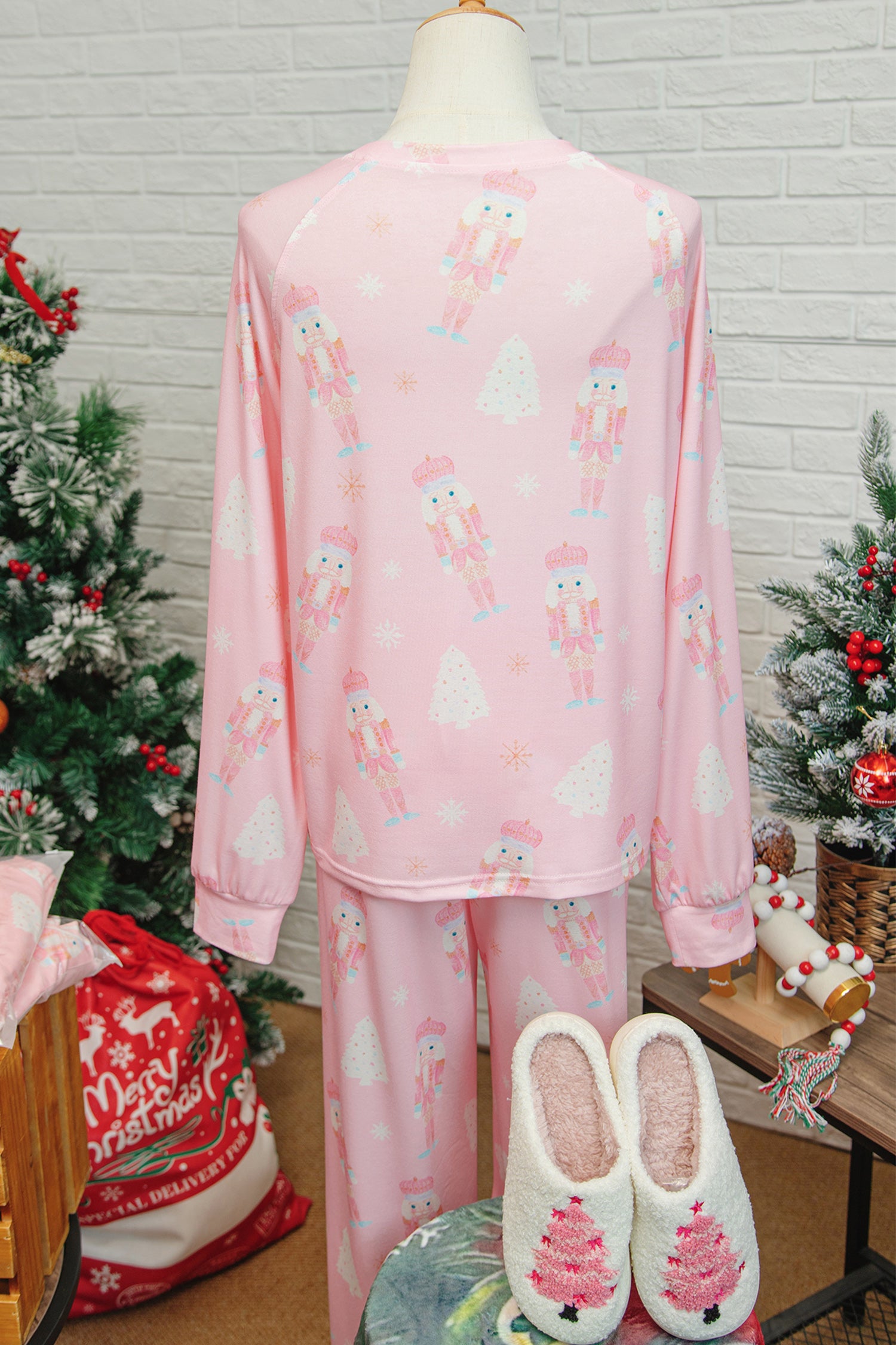 LuckeLadybug LLC Christmas pajamas in pink with nutcracker and tree pattern, perfect for holiday festivities