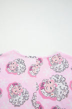 Pink Christmas pajamas featuring Santa Claus faces and snowflake patterns for festive wear