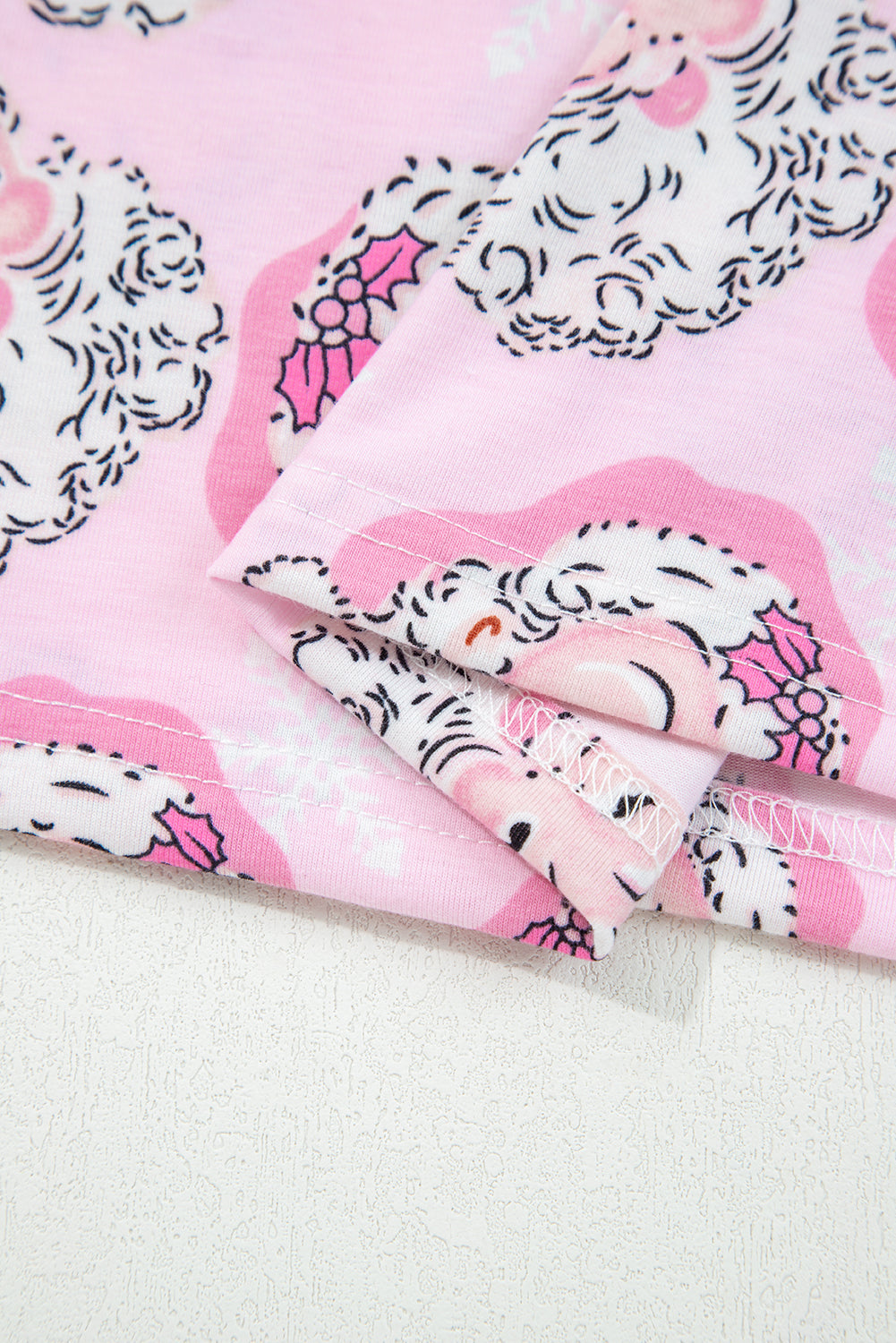 LuckeLadybug LLC Christmas pajamas in pink featuring cute holiday patterns and cozy fabric