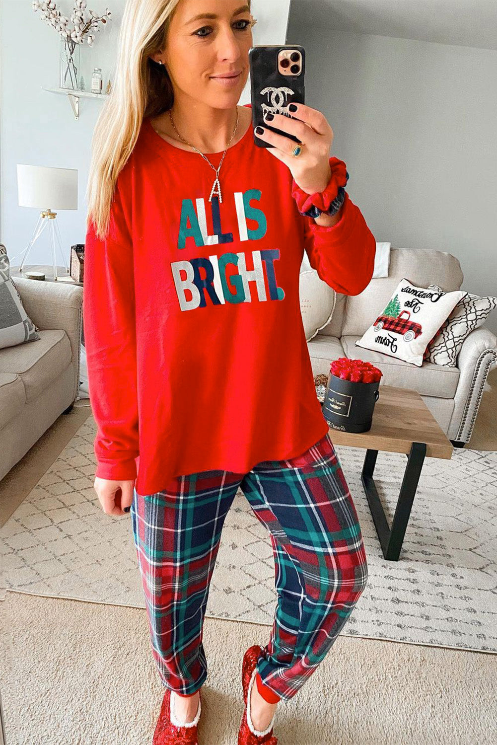 LuckeLadybug Christmas pajamas featuring a red top with 'All is Bright' and plaid pants for festive comfort
