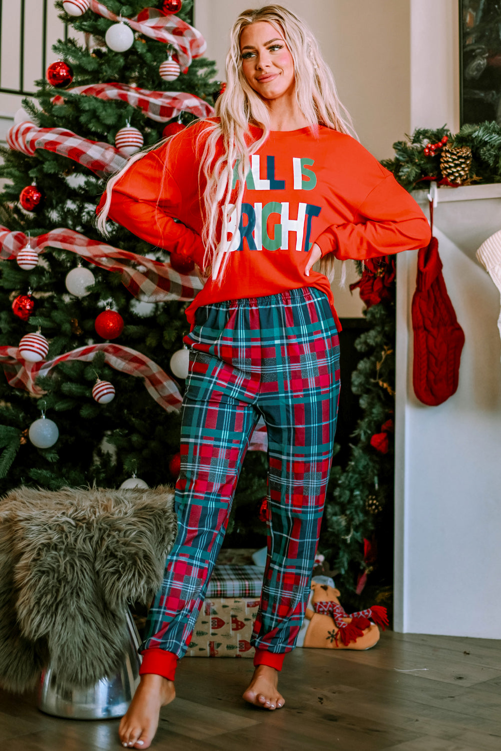 LuckeLadybug Christmas pajamas featuring a bright red top and plaid pants for festive holiday comfort