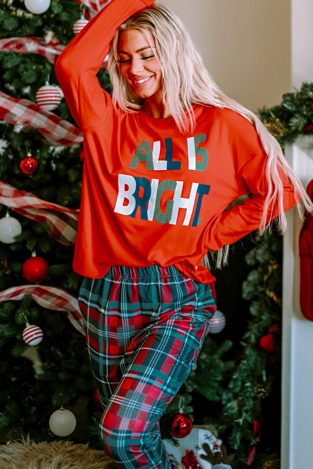 LuckeLadybug Christmas pajamas set featuring a red top and plaid pants for festive comfort