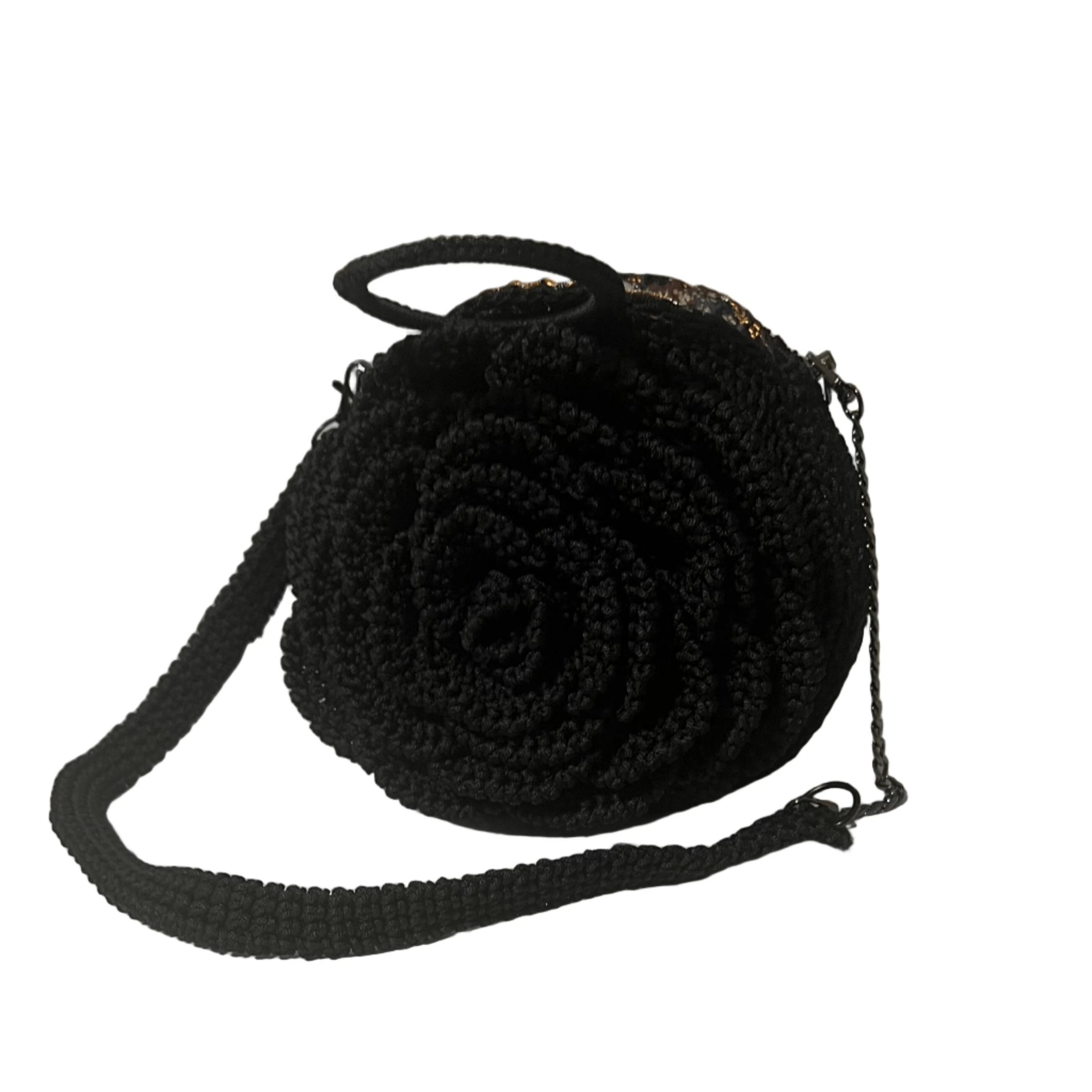 Black crochet crossbody bag shaped like a rose, stylish and perfect for casual outings, featuring the coach floral bag design