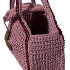 Handcrafted ThreadsByHannah pink clutch with textured design, resembling a coach handbag pink.
