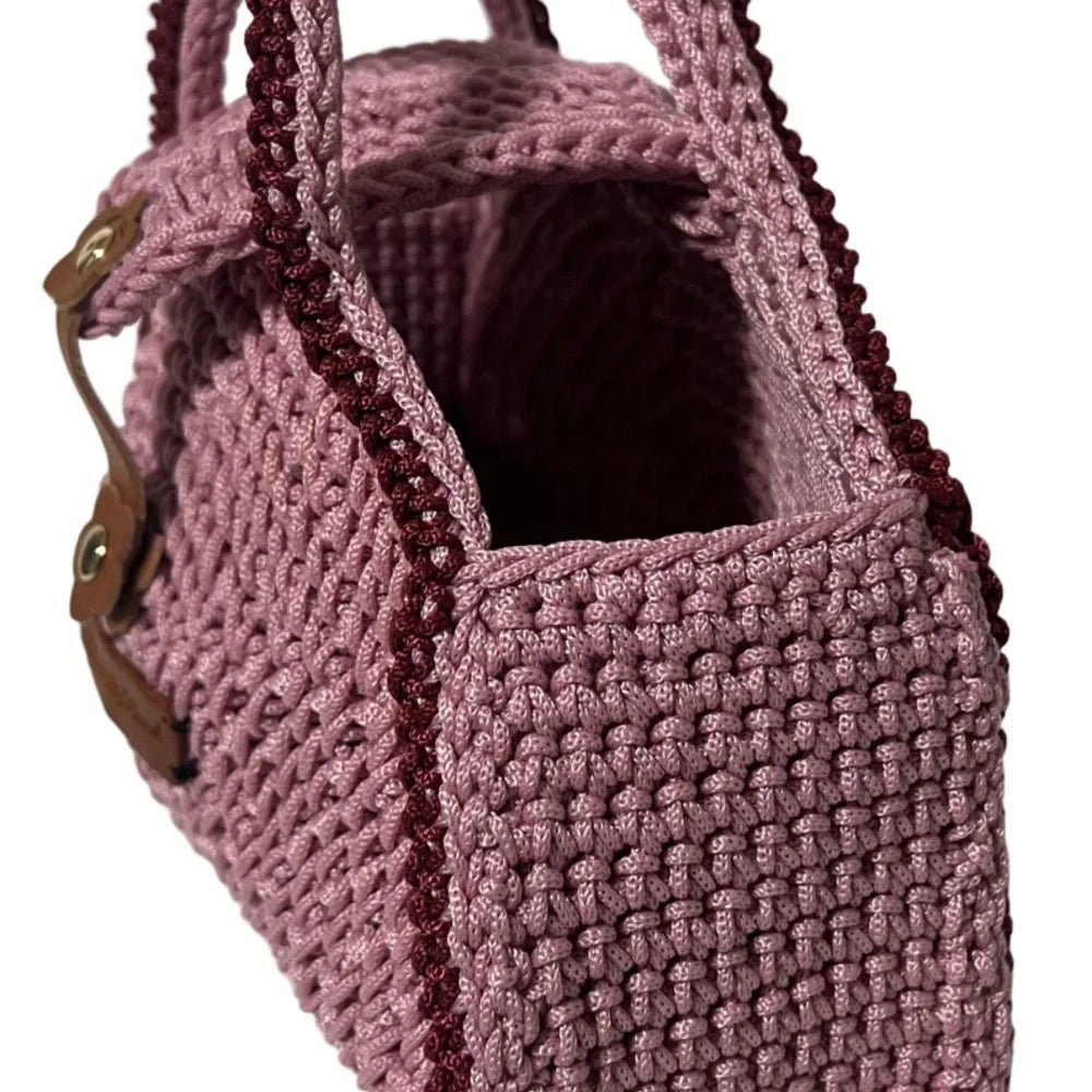 Handcrafted ThreadsByHannah pink clutch with textured design, resembling a coach handbag pink.
