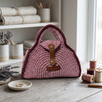 Handcrafted pink clutch from ThreadsByHannah resembling a coach handbag pink for stylish occasions