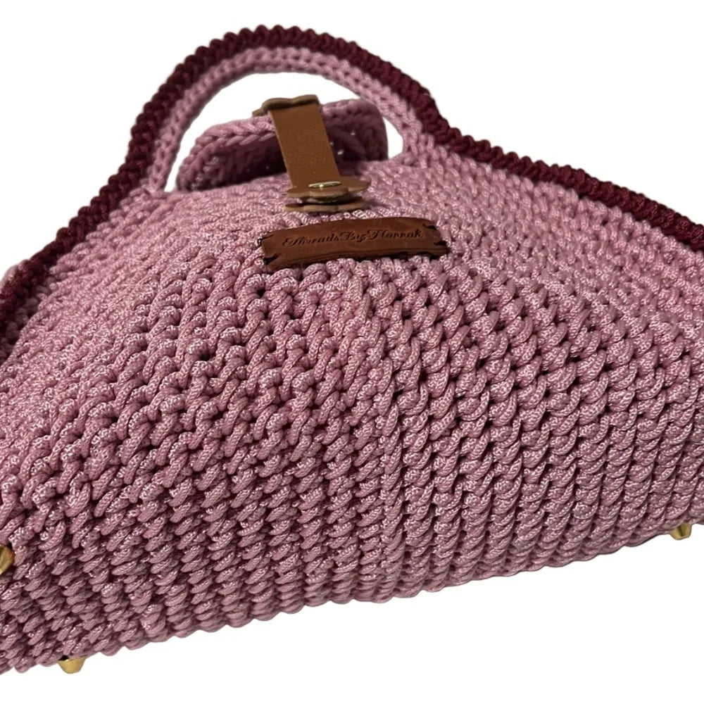 Handcrafted pink clutch by ThreadsByHannah, resembling a coach handbag pink with unique textured design