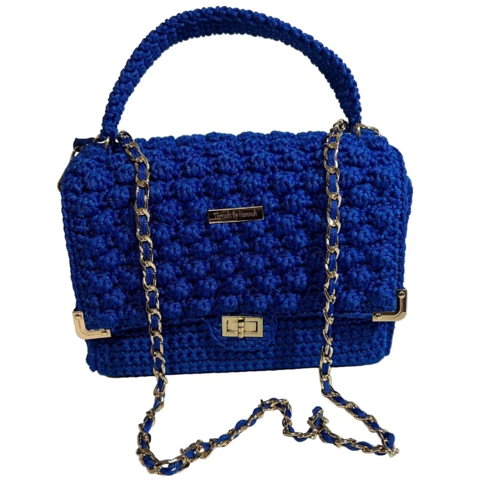 Blue crochet clutch with chain strap from ThreadsByHannah, ideal as a coach handbag purse