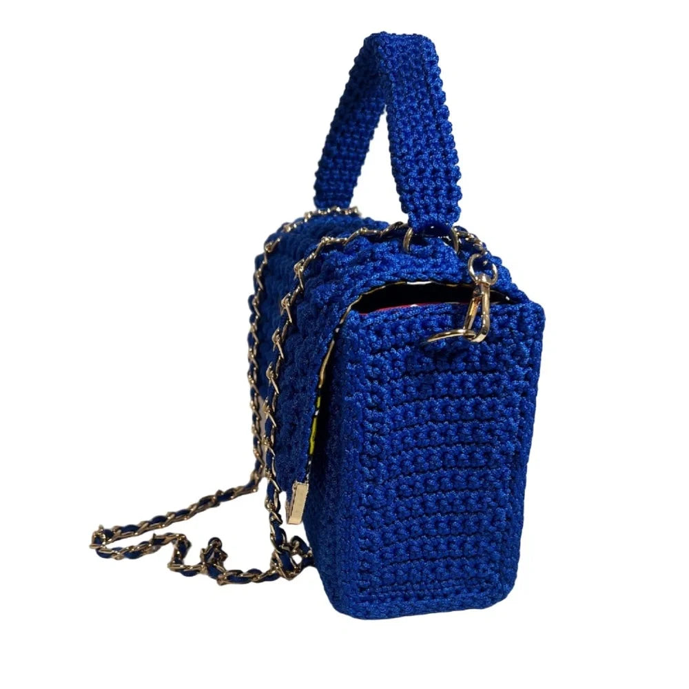 Handcrafted blue crochet clutch with a gold chain strap, perfect as a coach handbag purse