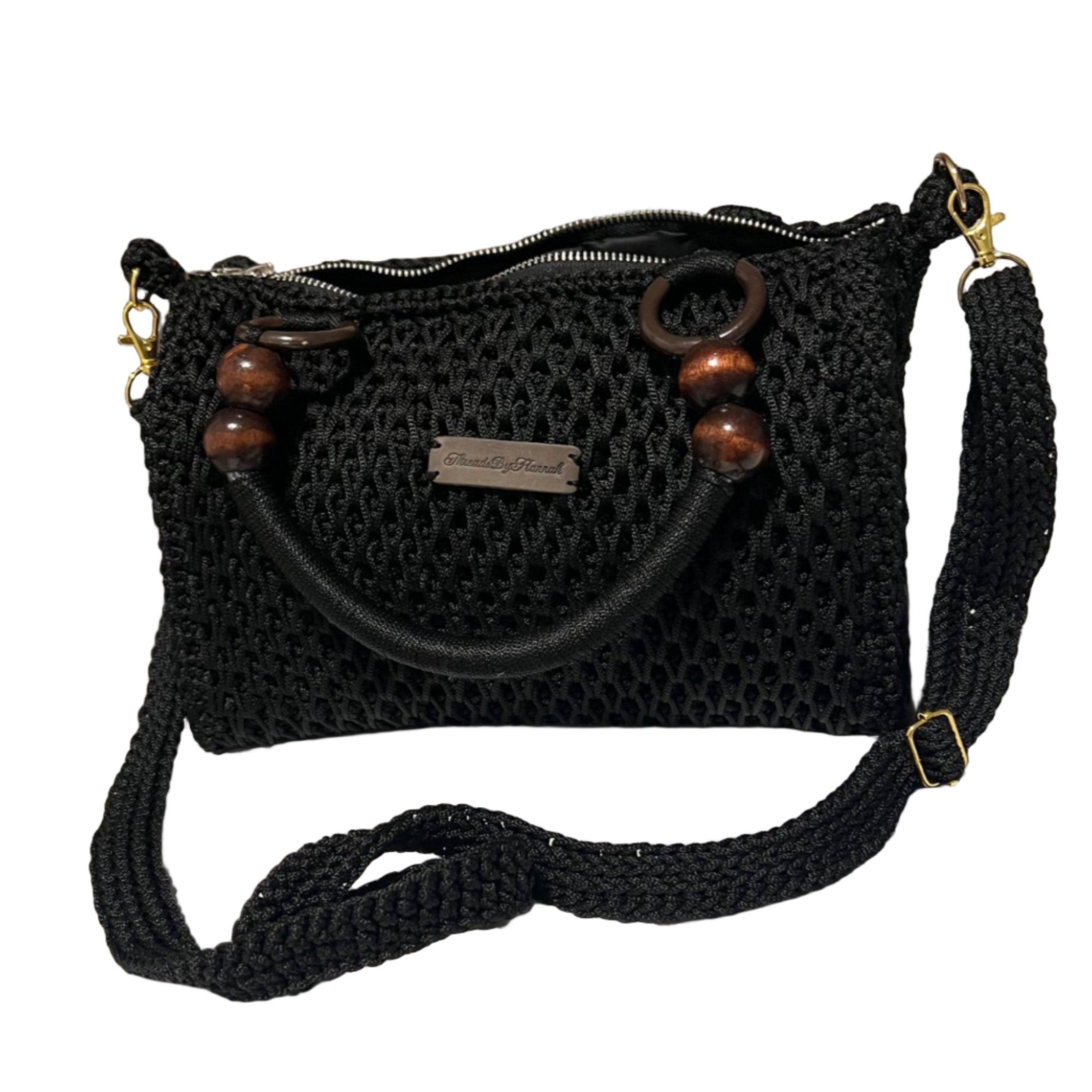 Black crochet coach purse shoulder bag with wooden accents and adjustable strap