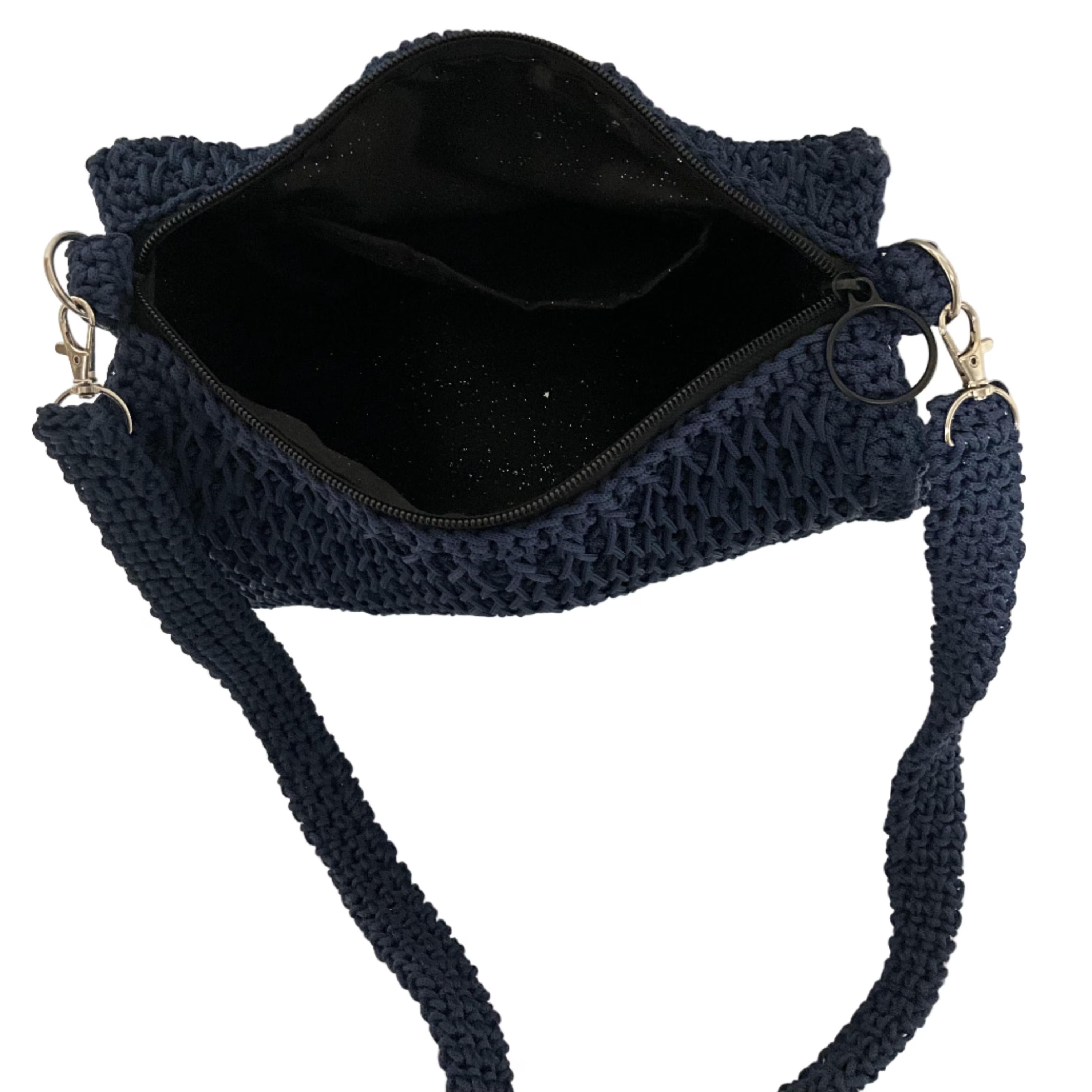 Interior view of a ThreadsByHannah coach purse shoulder bag featuring a navy crochet design