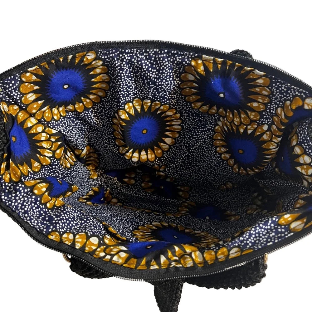 Interior view of coach purse shoulder bag featuring vibrant floral lining and spacious compartments