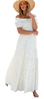 LuckeLadybug white floral maxi dress off shoulder smocked bodice worn by woman on sandy beach