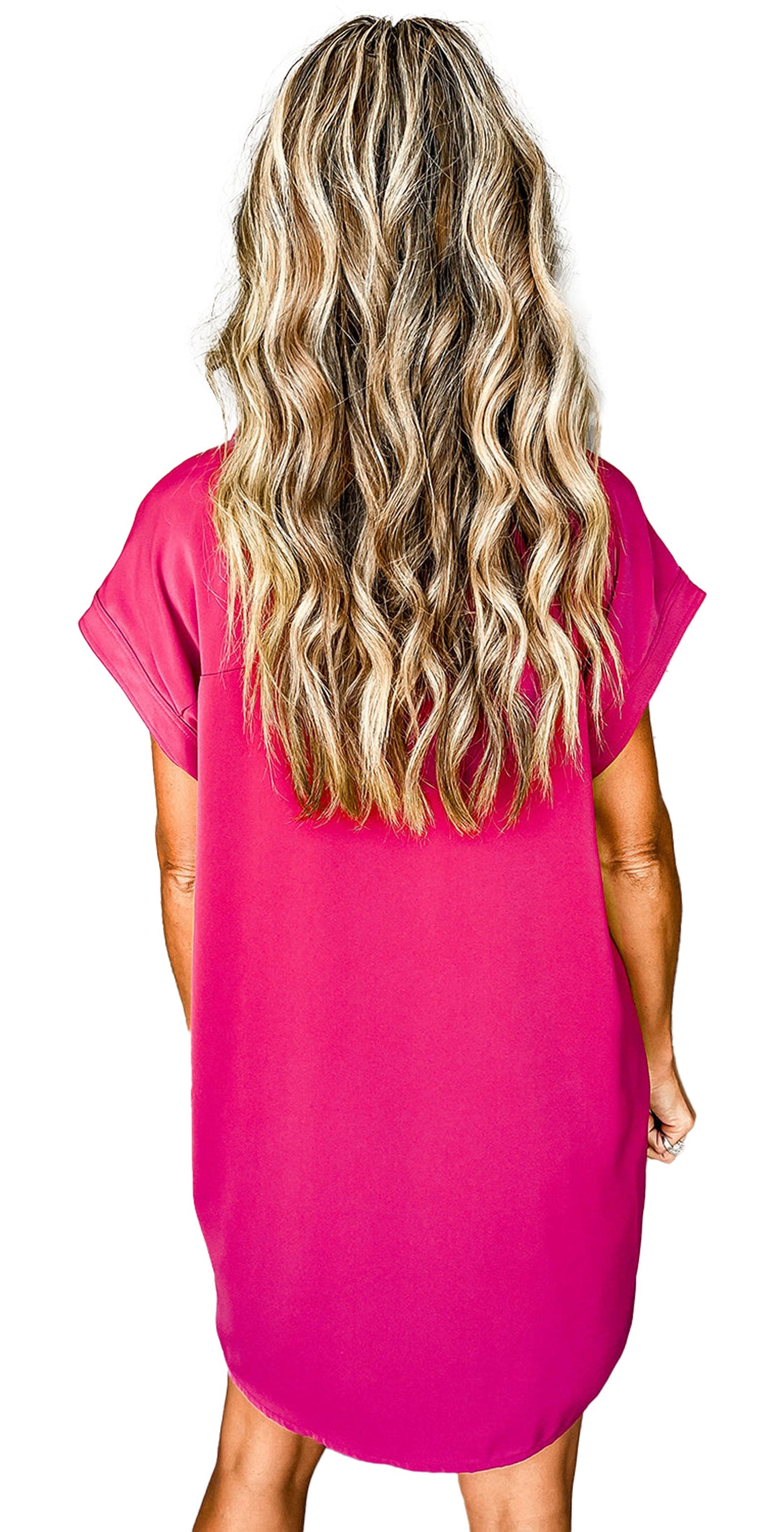 Back view of model wearing rose red button down mini dress with short sleeves relaxed fit and curved hem