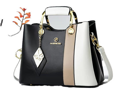 LuckeLadybug LLC colorblock top handle satchel with gold accents and charm detail