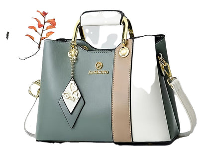 Colorblock top handle satchel from LuckeLadybug LLC featuring stylish design and a charming keychain accessory