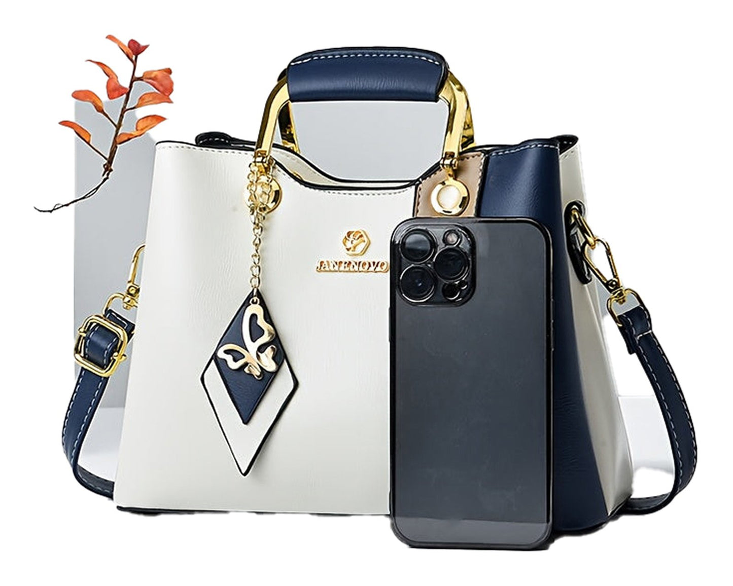 LuckeLadybug colorblock top handle satchel in cream and navy with gold accents and charm