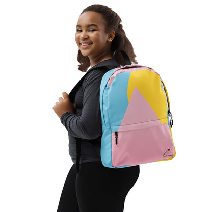 Young woman wearing LuckeLadybug colorful trendy backpack with blue, pink, and yellow geometric design