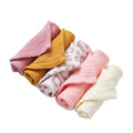 Set of LuckeLadybug cotton washcloths in pink, yellow, and white with stylish designs for everyday use