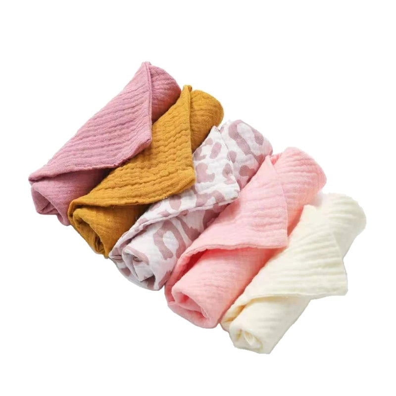 Set of LuckeLadybug cotton washcloths in pink, yellow, and white with stylish designs for everyday use