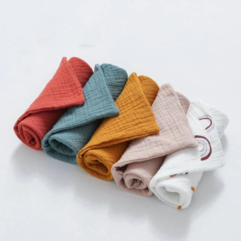 Set of colorful cotton washcloths rolled neatly for bathroom or kitchen use