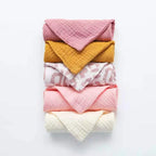 Colorful set of cotton washcloths in pink, yellow, and printed designs for everyday use