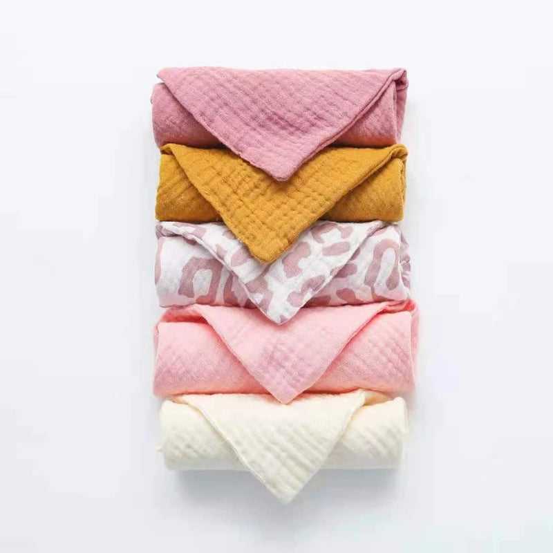 Colorful set of cotton washcloths in pink, yellow, and printed designs for everyday use
