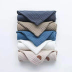 Soft cotton washcloths stacked in various colors and patterns for versatile use