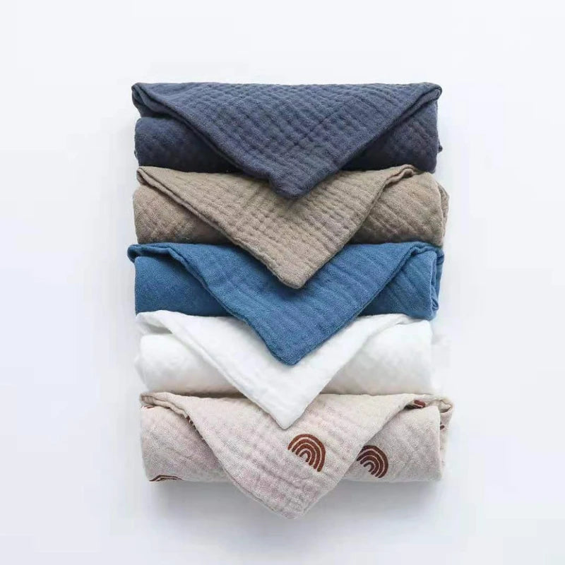 Soft cotton washcloths stacked in various colors and patterns for versatile use
