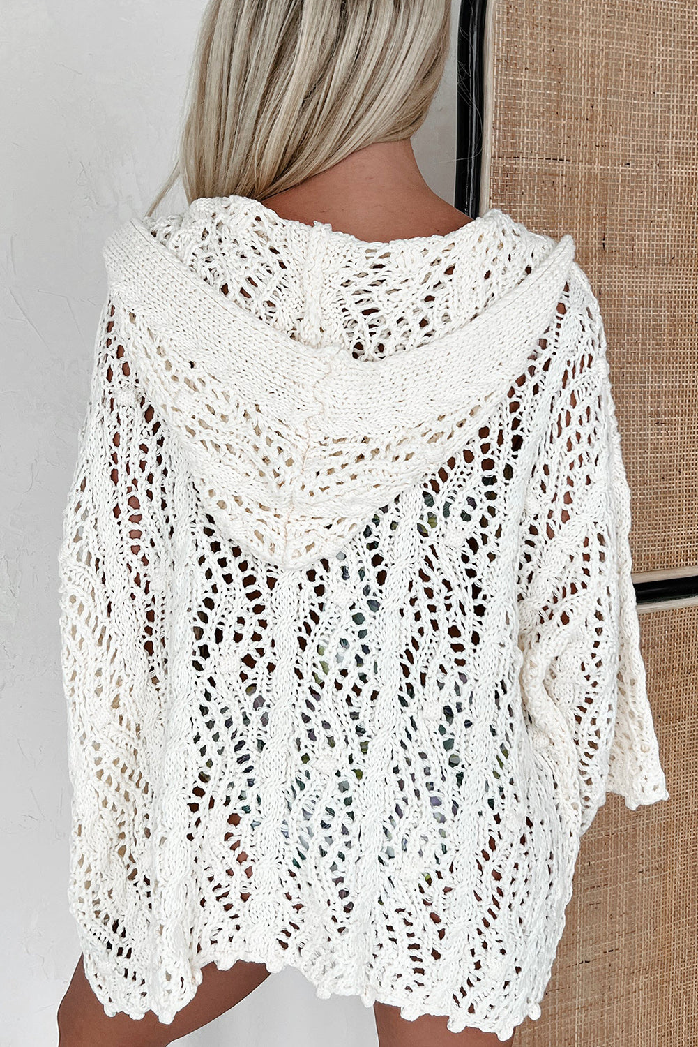 Lace-knit white cover up for the beach with a cozy hood for stylish summer outings