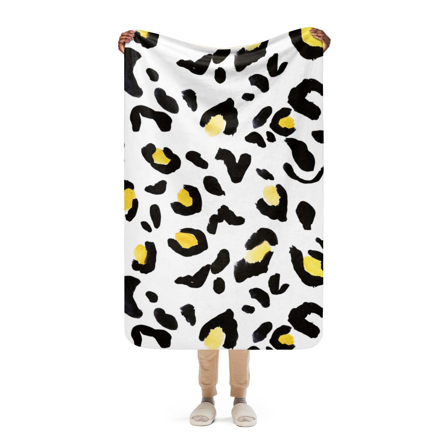 LuckeLadybug sherpa blanket with black and yellow spots featuring cozy animal print bedding design