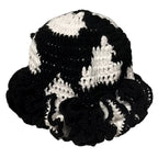 Handmade black and white crochet hat with ruffle, perfect for stylish accessories