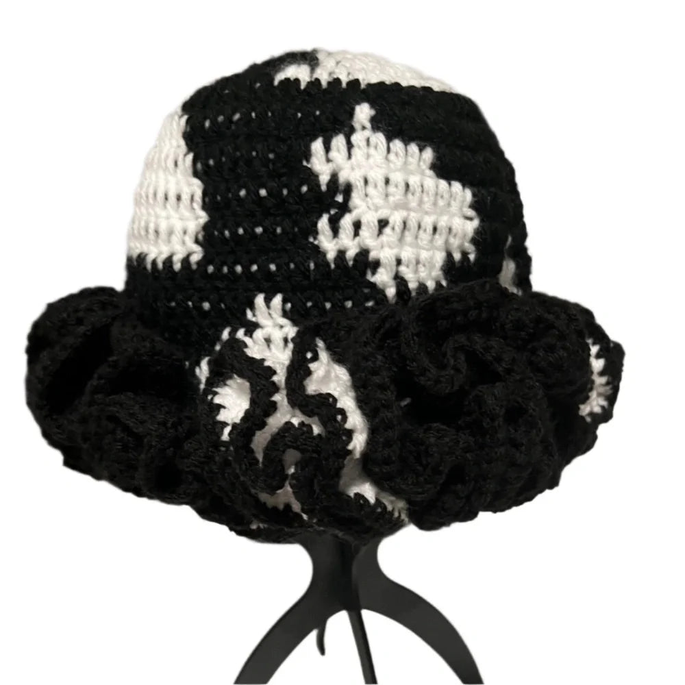 Crochet hat with ruffle in black and white design showcasing a stylish floppy style