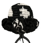 Crochet hat with ruffle in black and white design showcasing a stylish floppy style