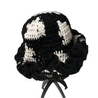 Black and white crochet hat with ruffle details for a trendy accessory look