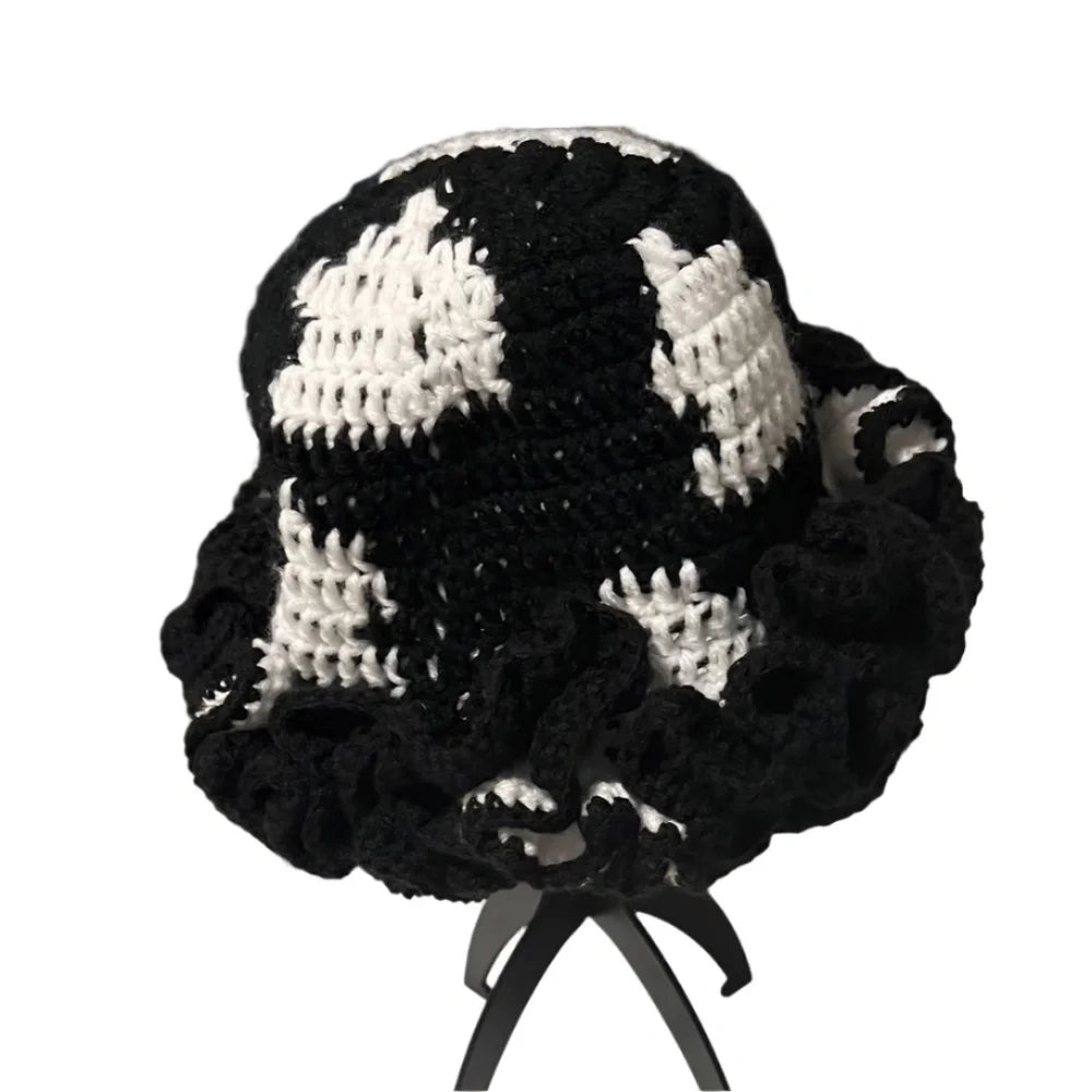 Black and white crochet hat with ruffle details for a trendy accessory look